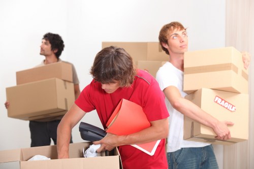 Furniture and boxes being loaded for a small removals service